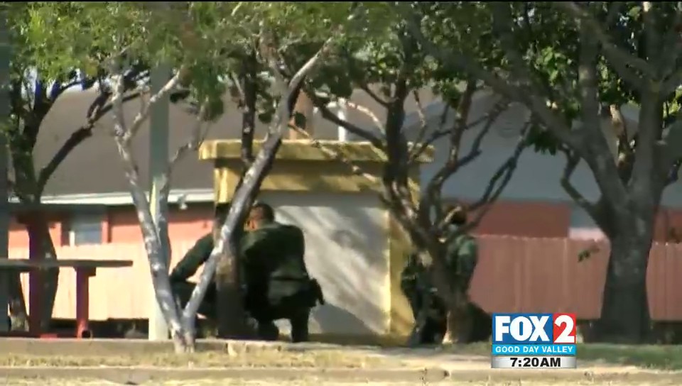 Two Officers Injured in Shooting Standoff with Gang Member item-thumbnail